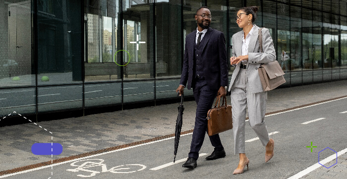 Couple of colleagues walking along the cycle path that is very close to the pedestrian zone