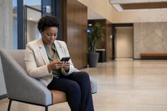 Citizen using a mobile phone while accessing public services.