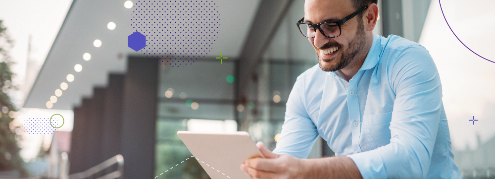 Portrait of a businessman with glasses and a tablet