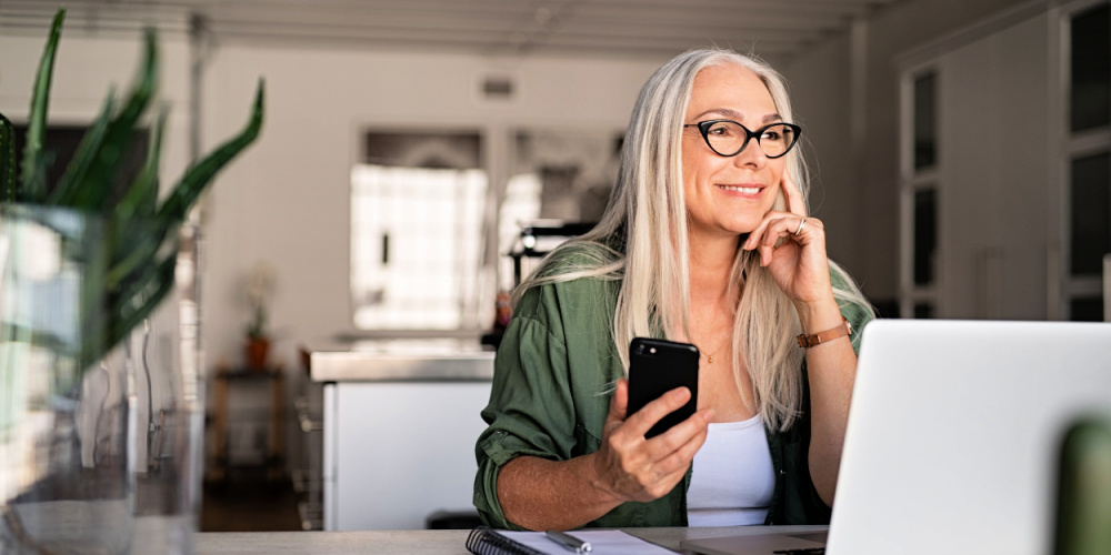 Woman in glasses video chatting with customer service