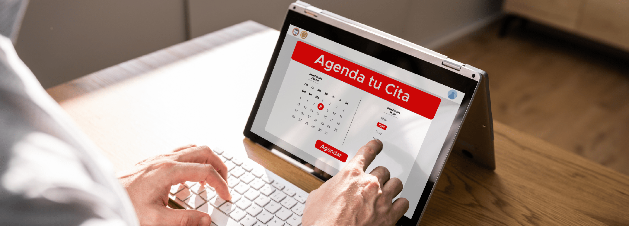 Manos de una persona realizando una cita virtual en una tablet - ACF