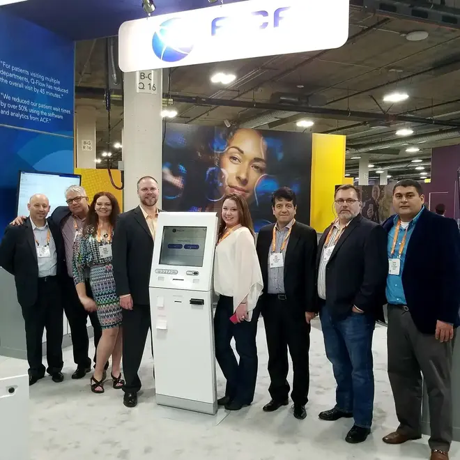 Photograph of ACF Technologies team assisting HIMSS