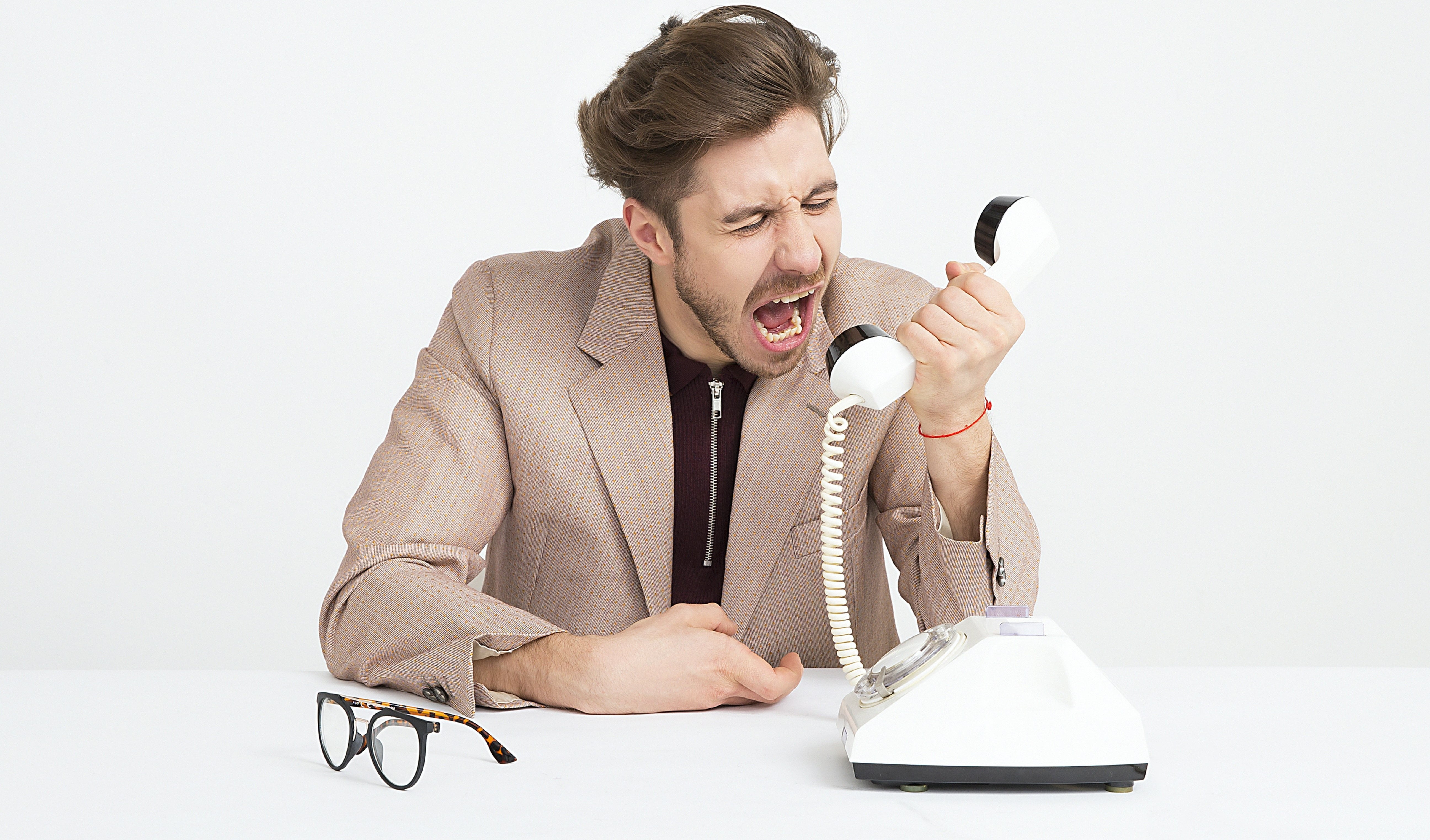 Man screaming into phone