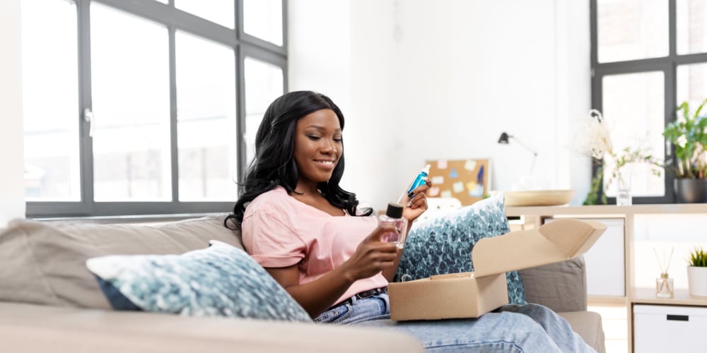 Woman happily opening a delivery